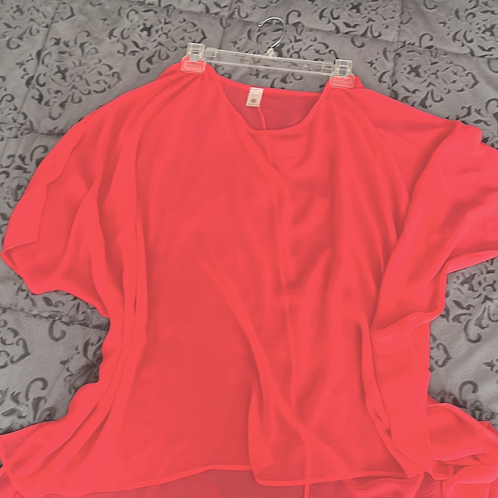 Very pretty coral semi sheer to layer. One size.